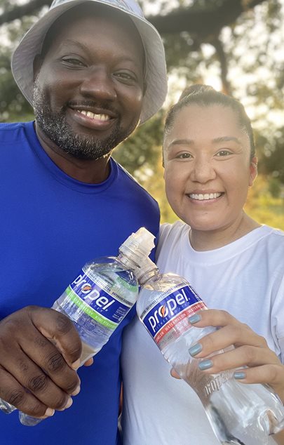 athletes posing for the camera with propel water